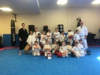 6 - 9 year old children's martial arts class in Basingstoke earning new belts